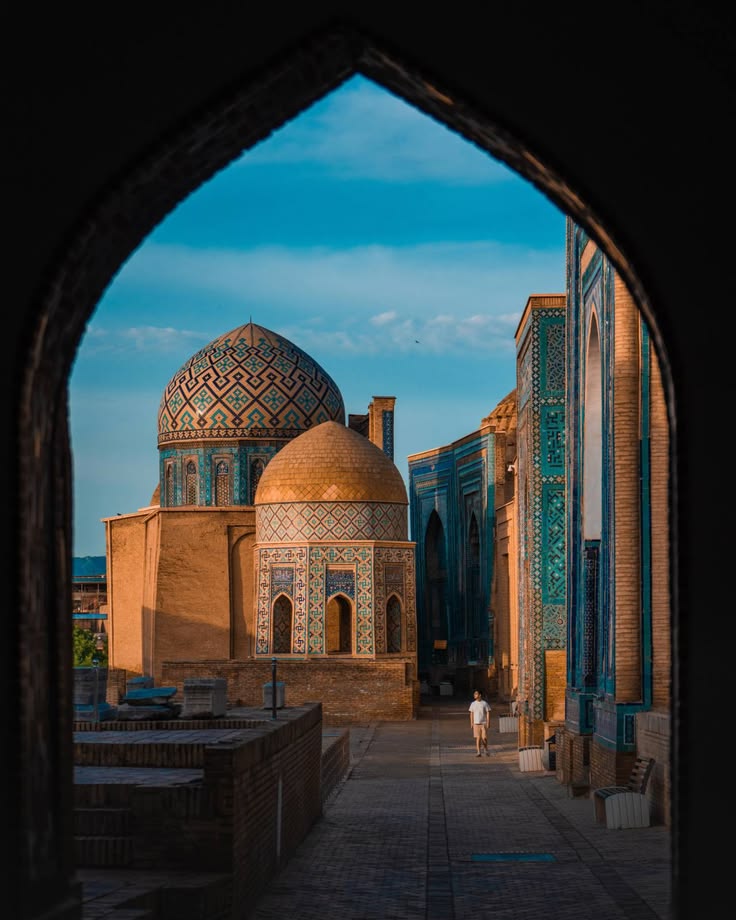 The tiled domes of Samarkand seen through an archway